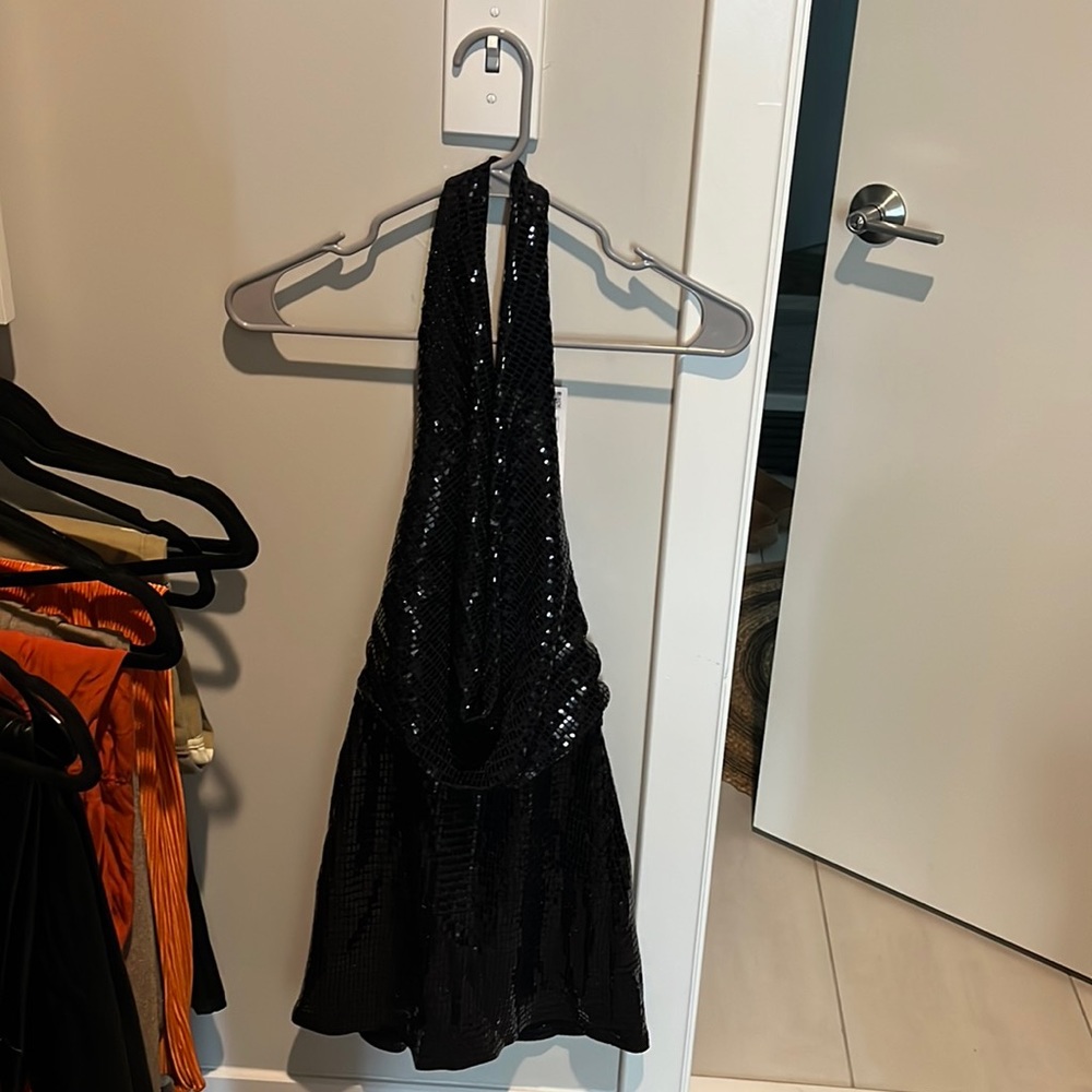Black sequin romper from Zara.